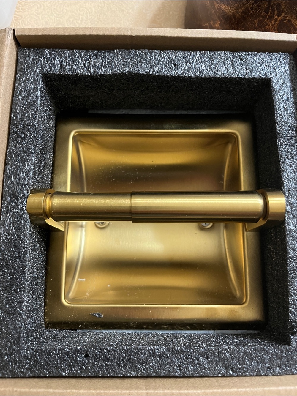 Brushed gold toilet paper holder